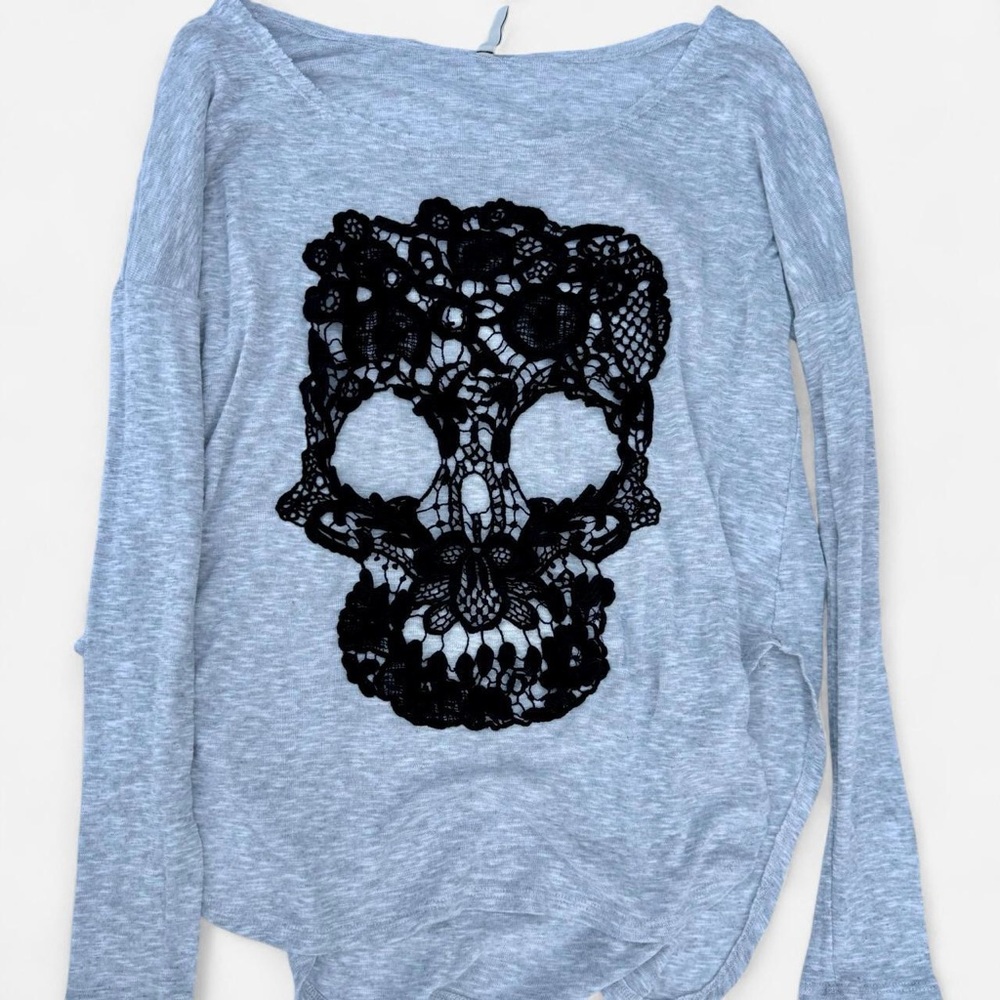 Grey long sleeve knit top with black lace skull detail